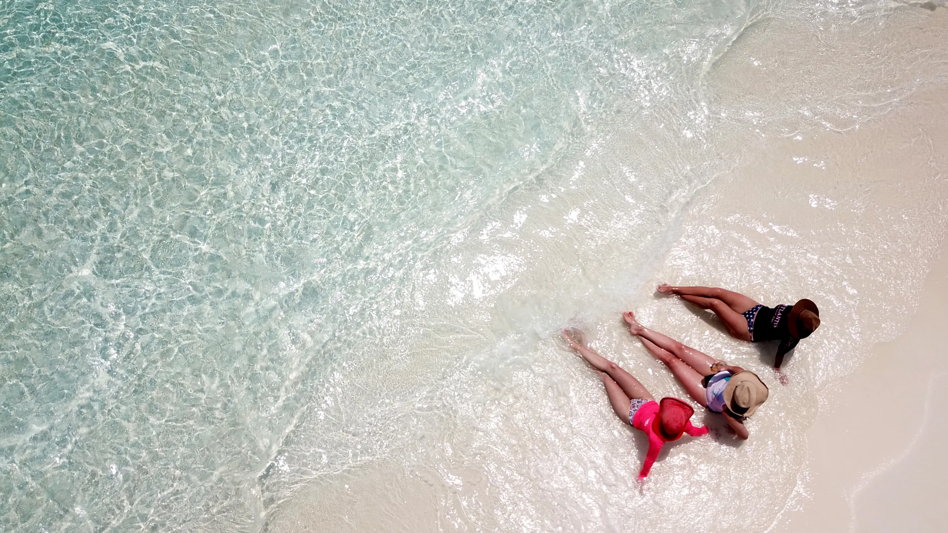 Private Access Circle by Odyssea Yachting — aerial of guests relaxing on a beach shore